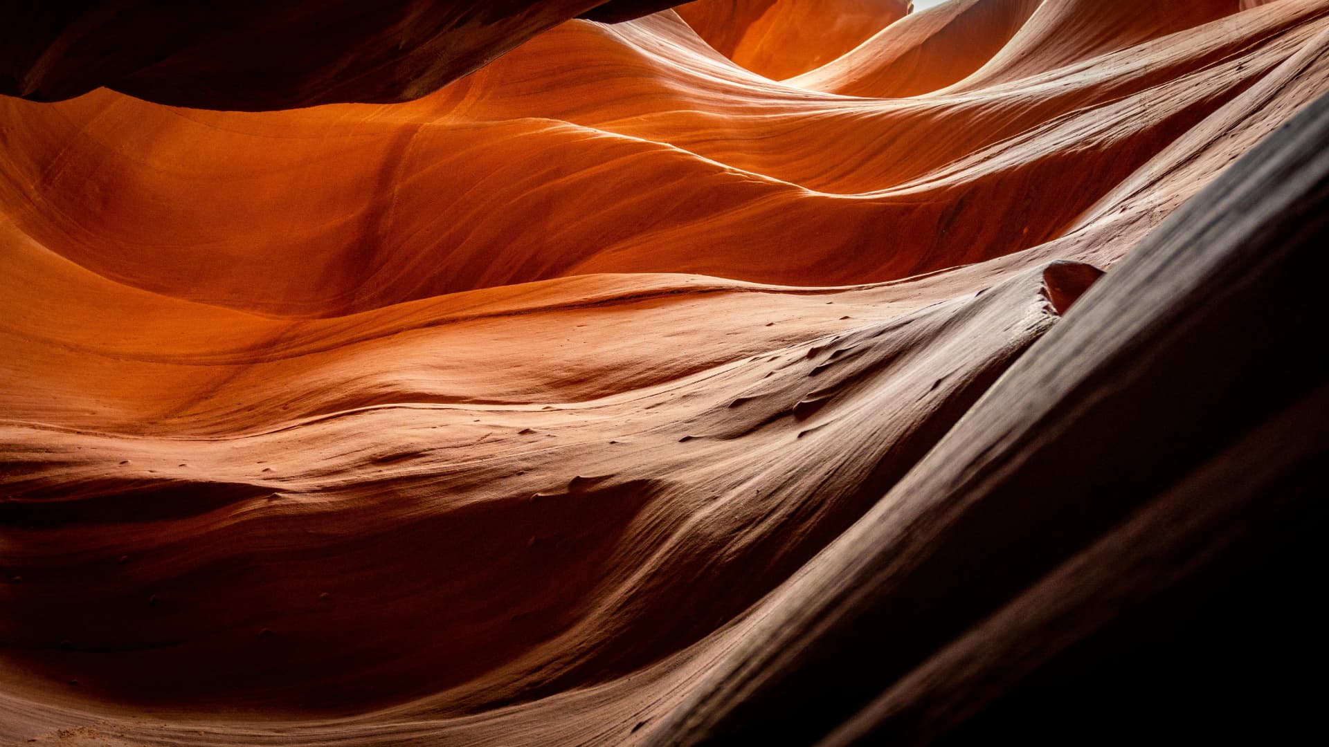 Flowing layers of sunlit sandstone